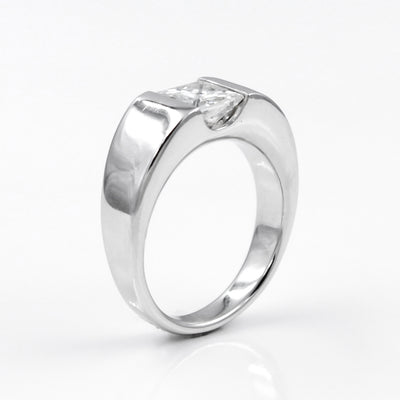 14K White Gold Solitaire Engagement Ring Featuring a Channel Set Princess Cut Moissanite
