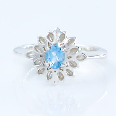 Sterling Silver Flower Ring with Oval Blue Swiss Topaz