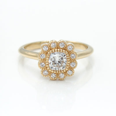 14K Yellow Gold Engagement Ring Featuring a Cushion Cut Diamond with Halo