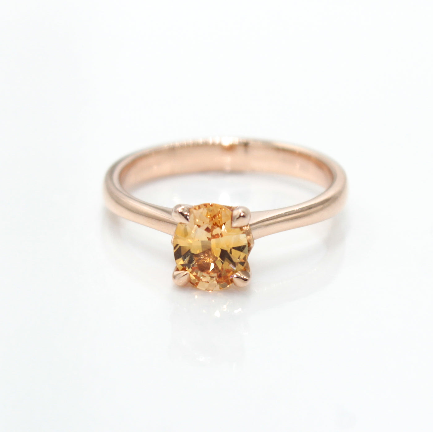 14K Rose Gold Solitaire Ring With Oval Orange Sapphire